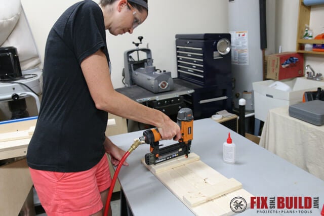 woman using ridgid brad nailer