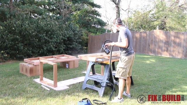 spraying finish on outdoor sofa