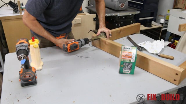 driving screws into sofa arms
