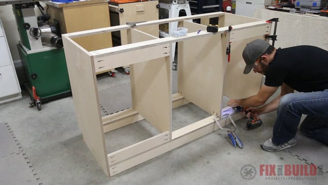 attaching mounting cleats to base cabinet
