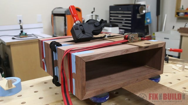 clamping a mitered box with strap clamps and ratchet straps