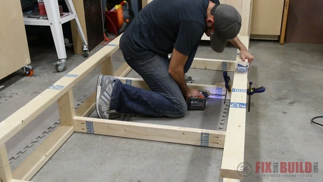 laying out twin bed frame with storage