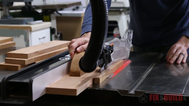 ripping down boards on a tablesaw