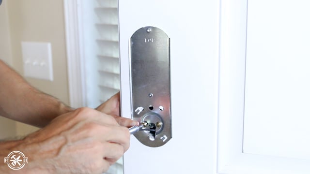 attaching inside of keyless deadbolt to front door