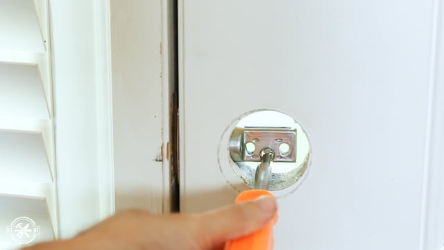 using screwdriver to close deadbolt