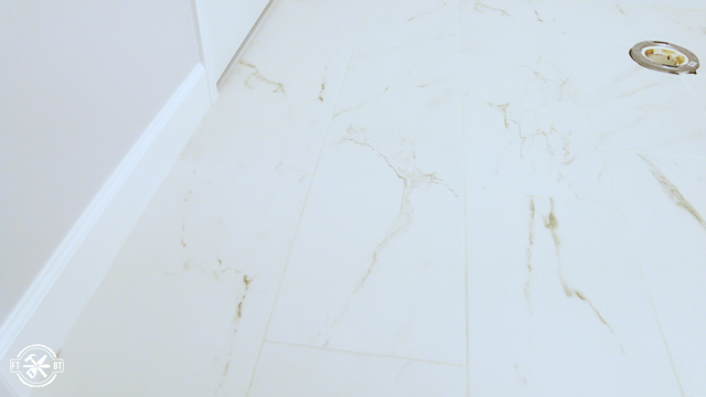bathroom floor with large tiles