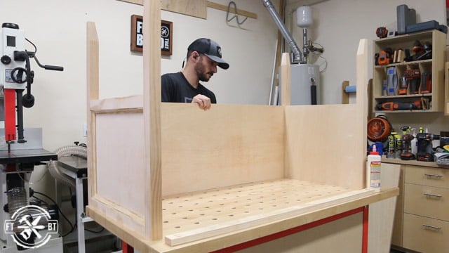 fitting the back stretcher on the wood desk