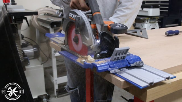 cutting down piece of wood with tools