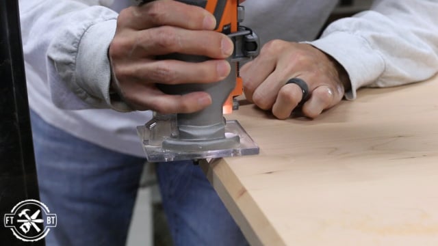 using cordless router to put chamfer on piece of wood
