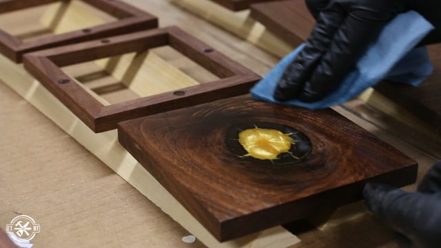 applying wipe-on oil-based polyurethane to the frame