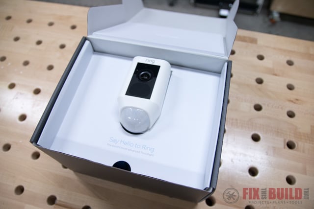 ring floodlight cam in box on wooden table
