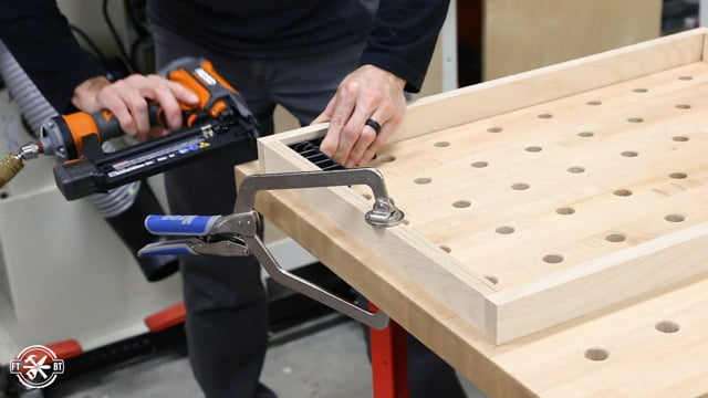 screwing together pieces of wood to make a drawer