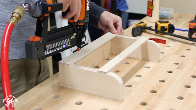 attaching the pieces of the wooden cubbies