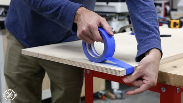 adding blue tape to table top to avoid tear out