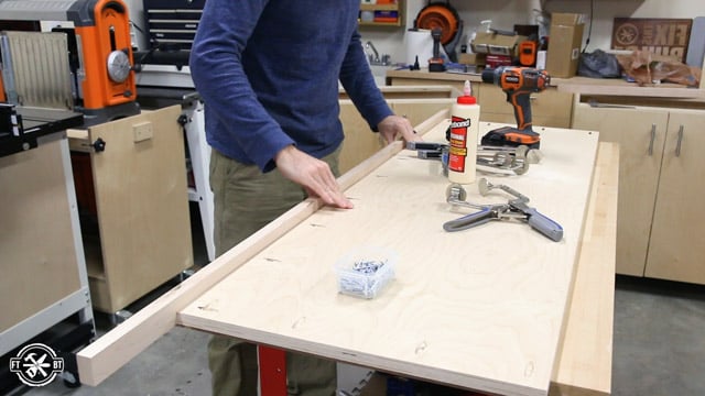 adding wood trim to the front of a large piece of wood