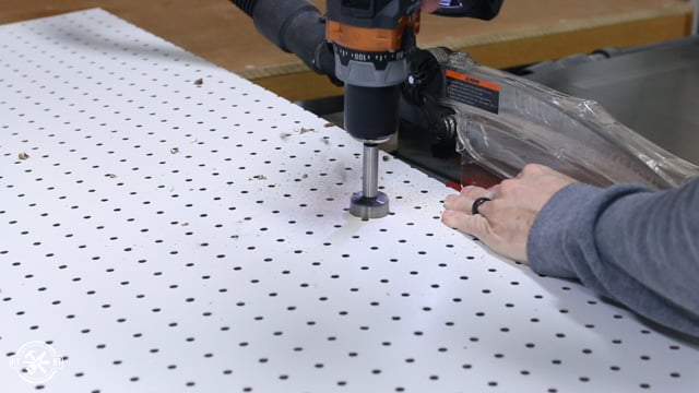 drilling holes in pegboard