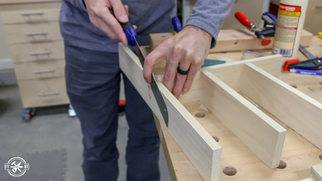 using pull saw to trim wood