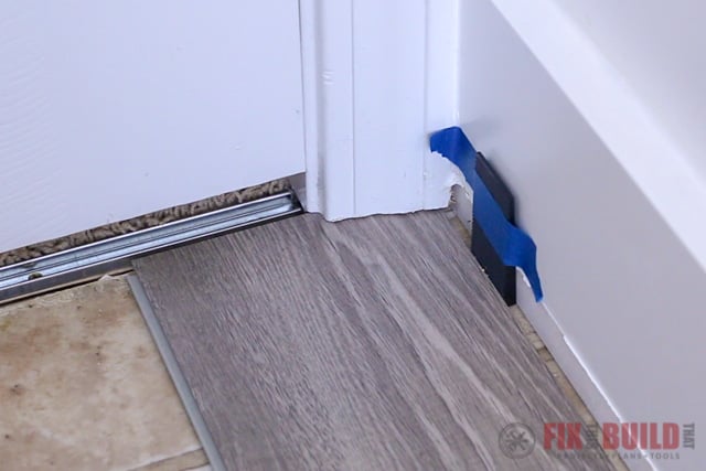installing vinyl plank flooring under door jamb