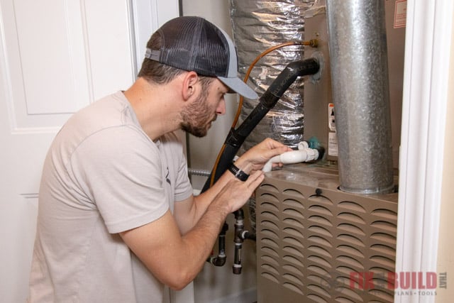 Checking condensate line on air conditioner