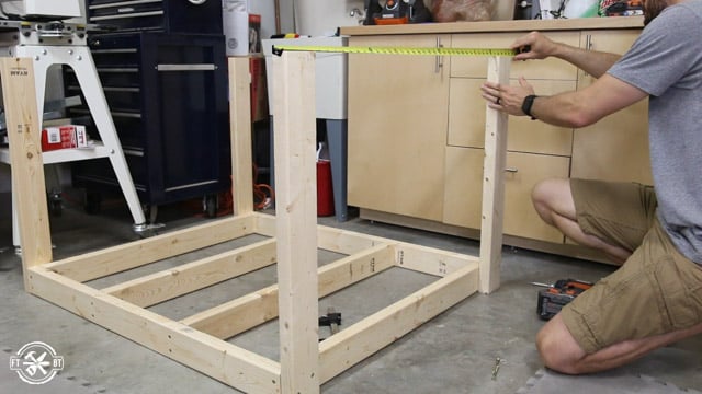 checking the distance between table legs at top and bottom