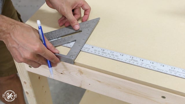 measuring and marking spots to attach work surface to top of table