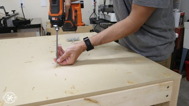 screwing the table top to the frame