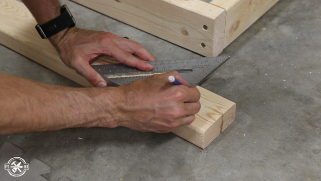 marking table legs to attach them with screws