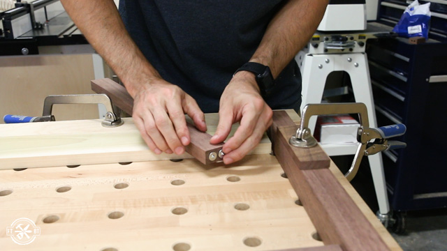 using metal dowel points to show where to drill holes