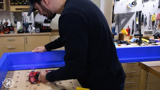 screwing piece of wood to bed frame