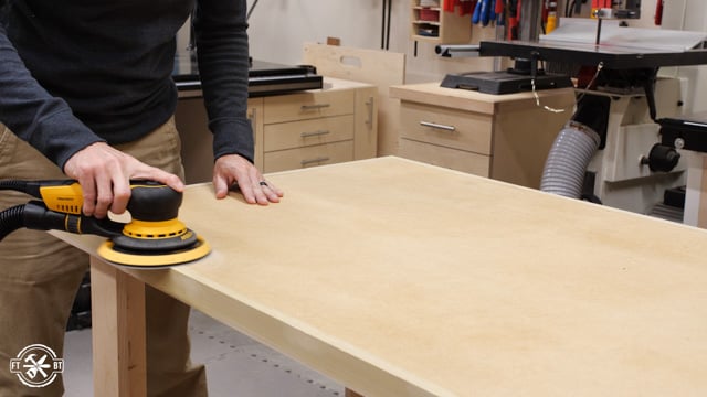 sanding the top and sides of table