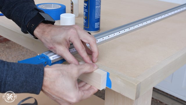 attaching sacrificial wood block to edge of table
