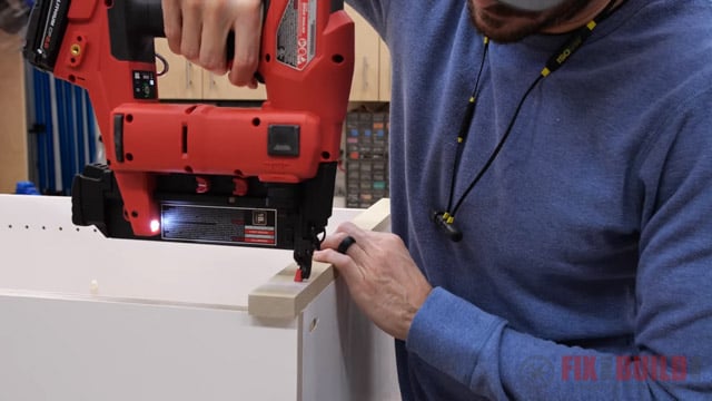 nailing trim piece to front of hutch