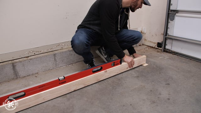 using level, 2x4 and shims to find slope in garage