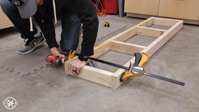 screwing together 2x4s for garage shelf