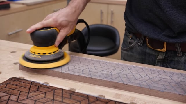 Sanding down wood with epoxy design