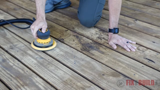 using an orbital sander on a deck