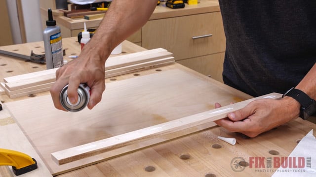 putting activator on strip of wood