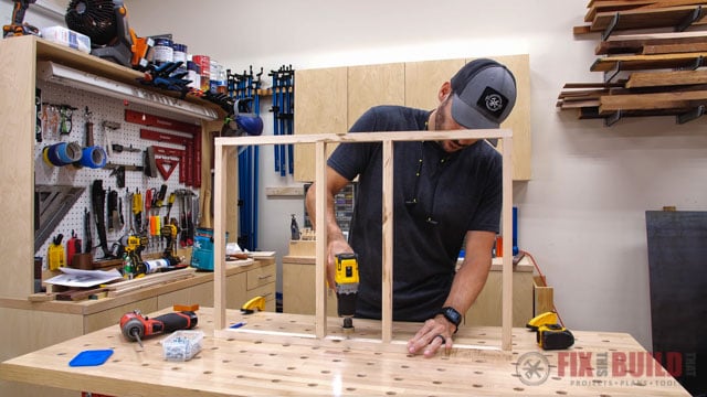 Predrilling holes in frame