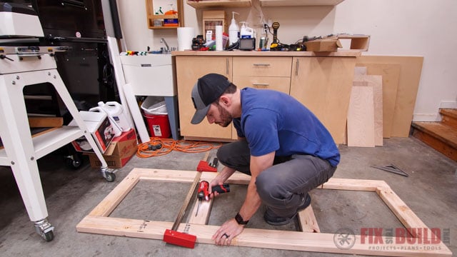 screwing together frame of base