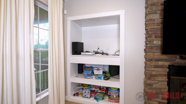 old TV nook with shelves below