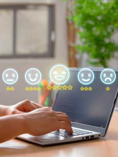 typing on laptop with reviews